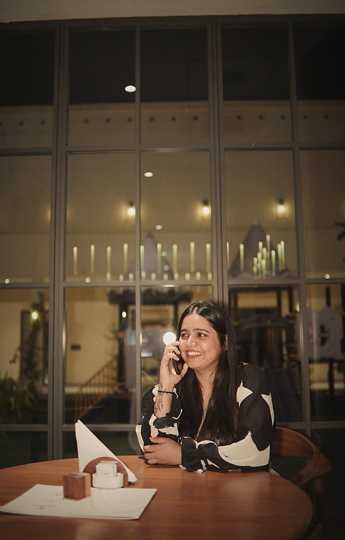 Anjali Bhanushali working at a boardroom table